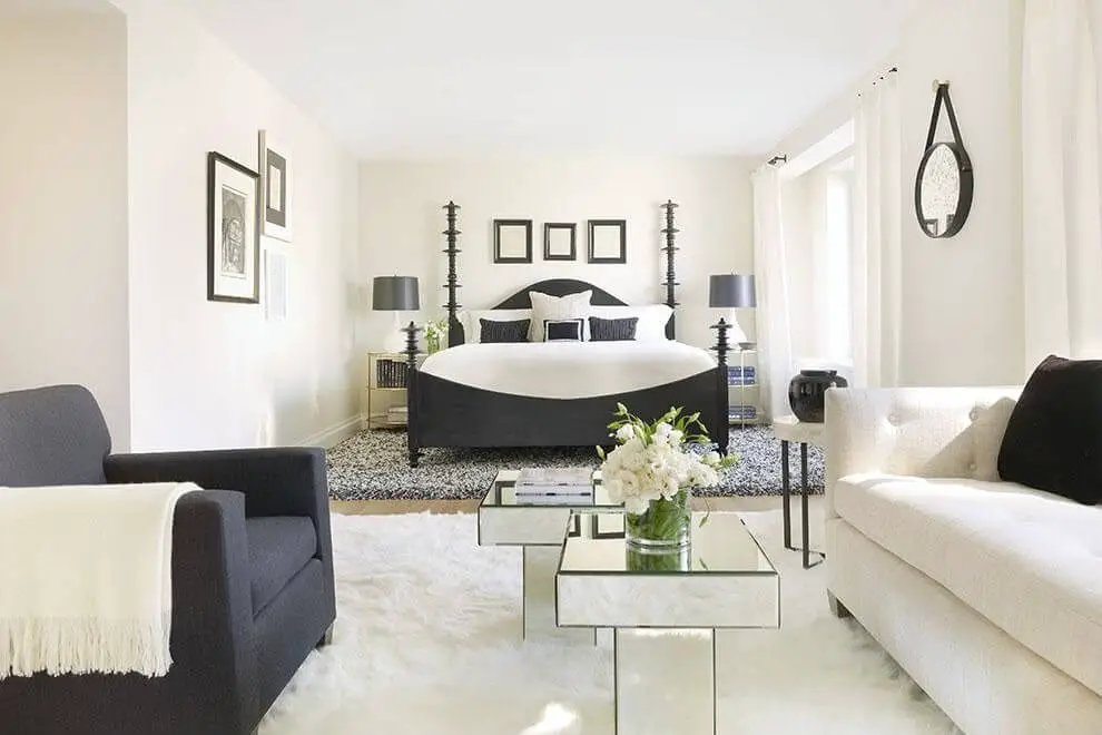 Decorating master bedroom with white walls and black chair