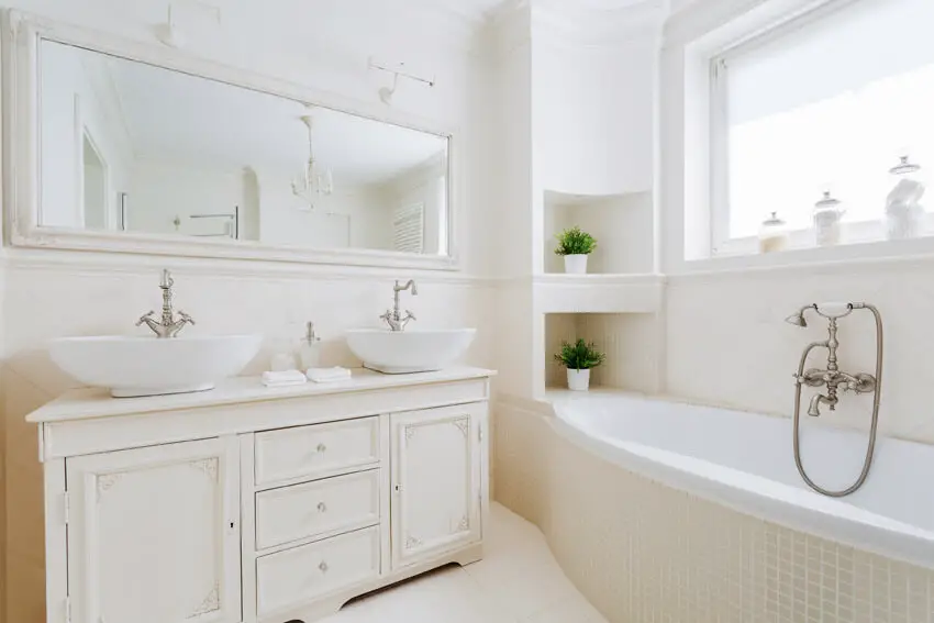 all white bathroom with large window