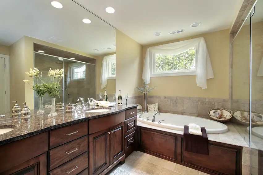 Bath granite counter yellow wall brown cabinets