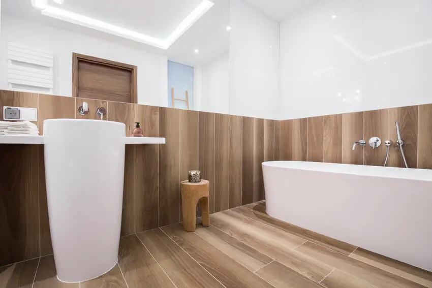 bathroom with wood accents and flooring