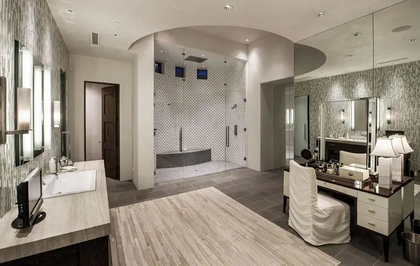 Beautiful luxury master bathroom with granite counter vanities and makeup counter