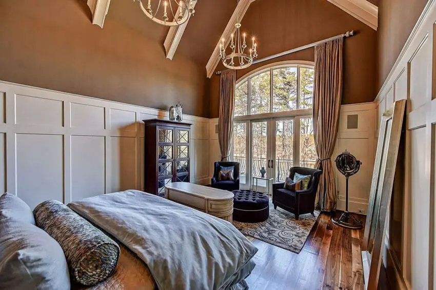 Bedroom with American Walnut Floors and Two Chandeliers