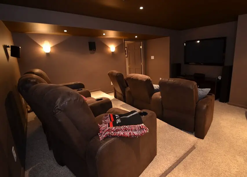 Brown Themed Home Theater With Comfortable Seats