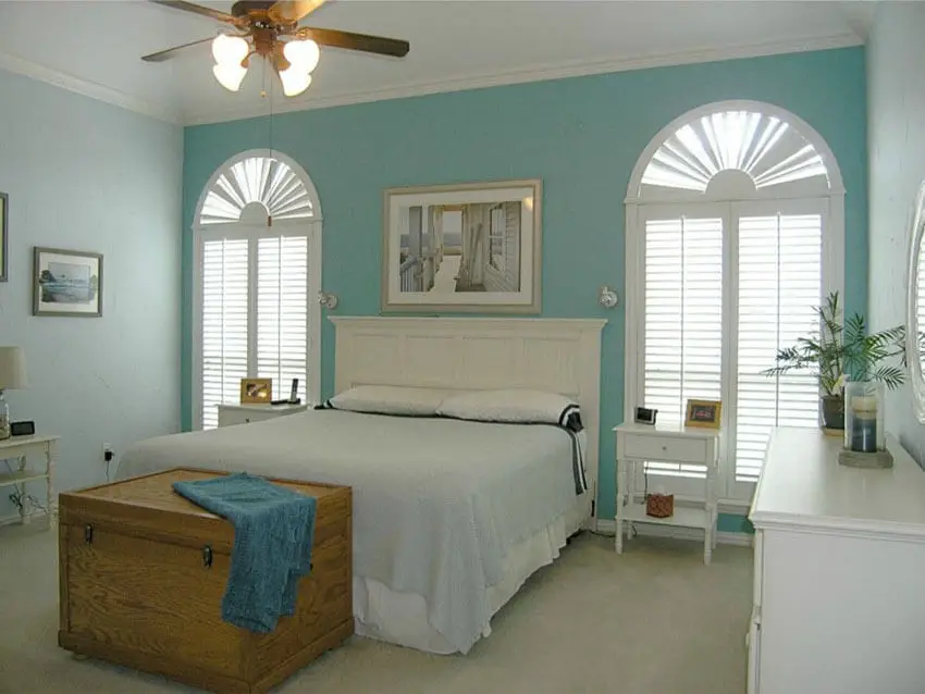 Cottage Style Bedroom with White and Blue Theme with Curved Decorative Windows and Plantation Shutters