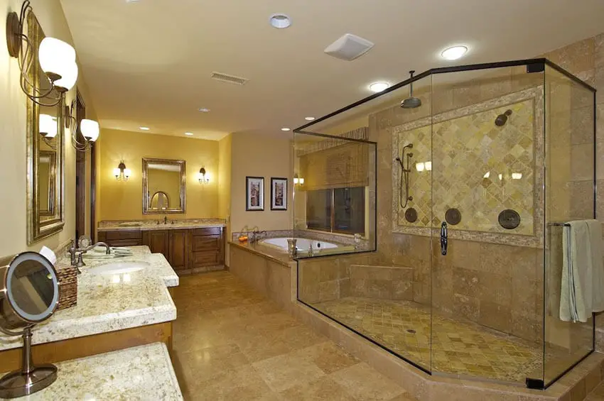 craftsman bathroom with bronze frame shower travertine tile granite counter and wood cabinetry