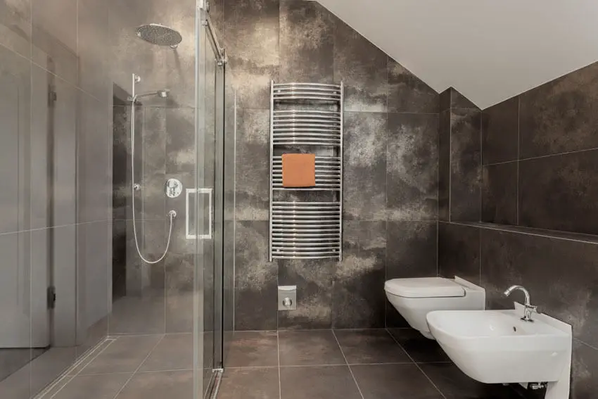 Dark tile bathroom with rainfall shower