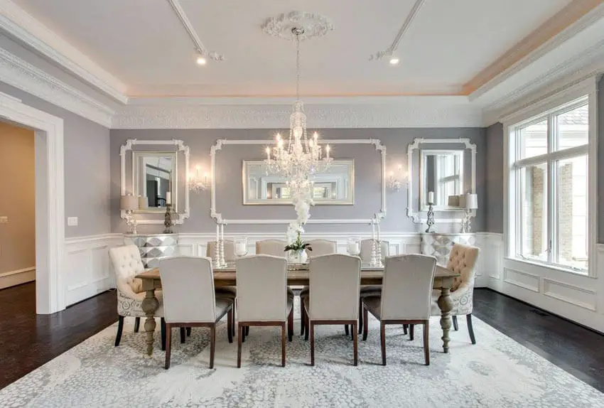 elegant gray formal dining room with wainscoting