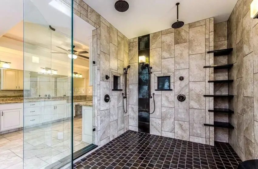 large travertine shower with rainfall showerhead and subway floor tile