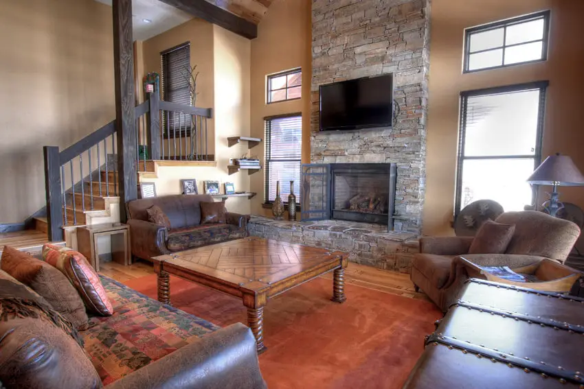 Leather Furniture In Living Room With Stone Fireplace