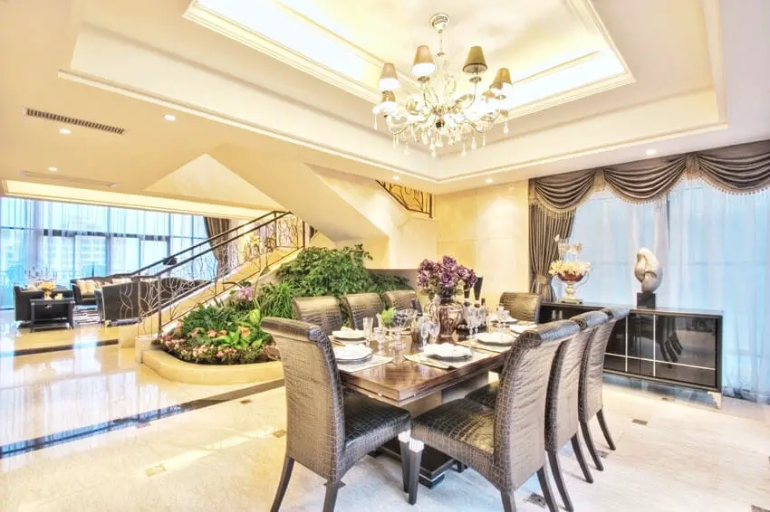 luxury dining room with tray ceiling