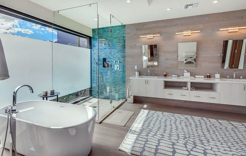 Luxury modern bathroom with aqua blue tile in shower