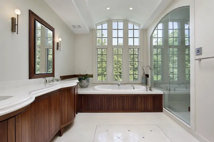 Master bath large glass shower door wood cabinetry