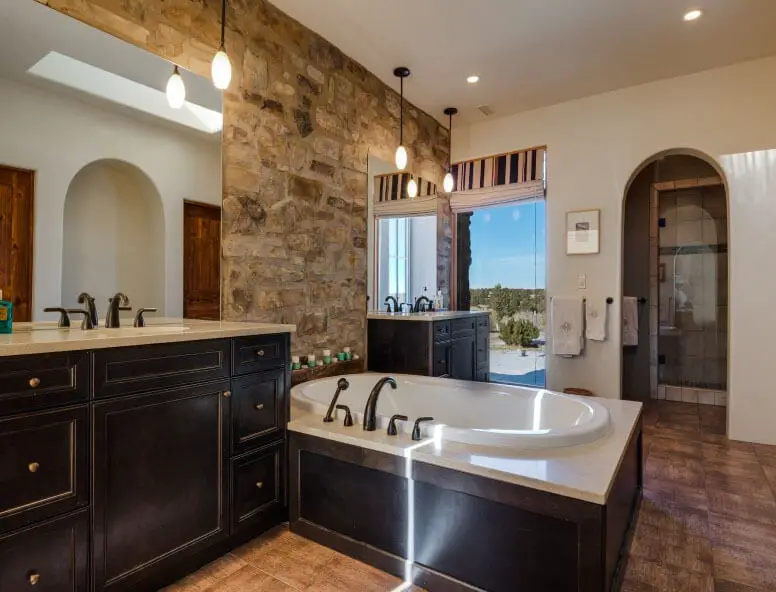 Master Bath with Rock Wall and Pendant Lighting