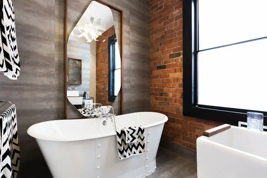 Modern bathroom with brick accent wall