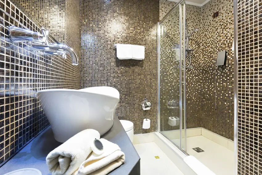 Modern bathroom with gold tile