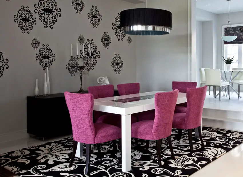 modern dining room with purple chairs large area rug