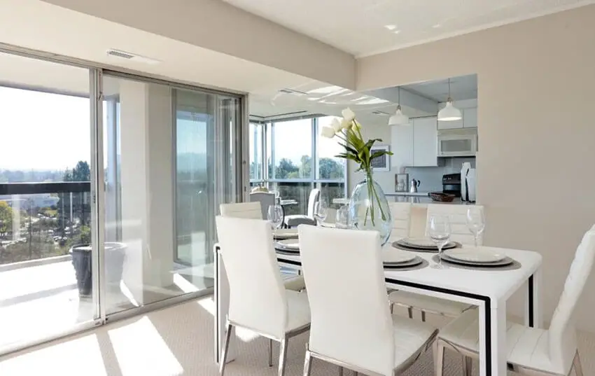 modern with dining room in beautiful home with balcony view