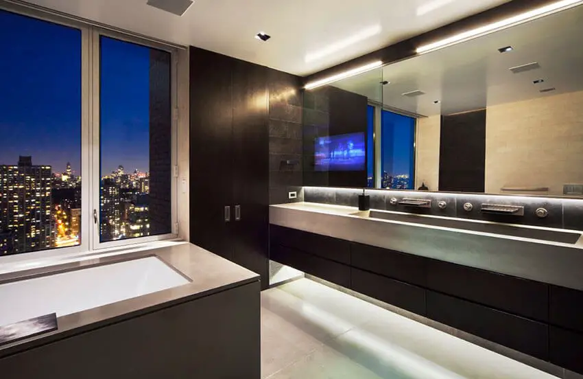 Sleek dark modern bathroom with high city views