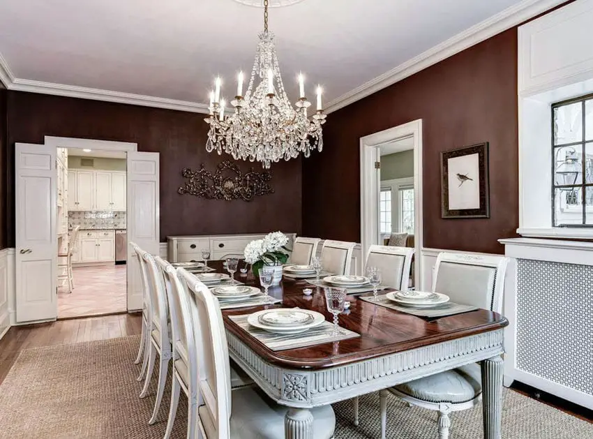 Traditional dining room with dark red and white color theme
