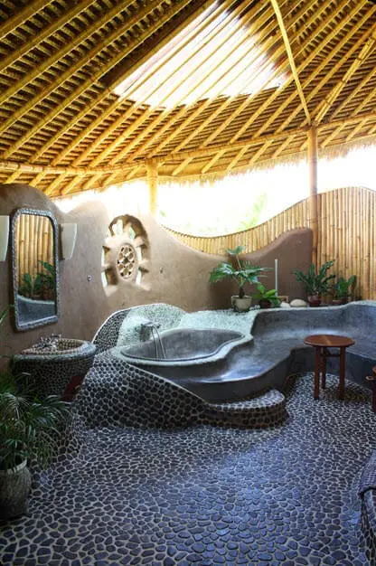 Original design of rustic bathroom with bamboo, stone and mud