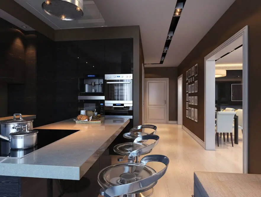Kitchen design with black tiles and light granite countertop