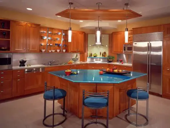 Kitchen with hexagonal island design with granite board