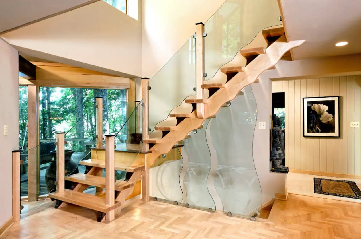 Stairs design with wavy wood and glass handrails