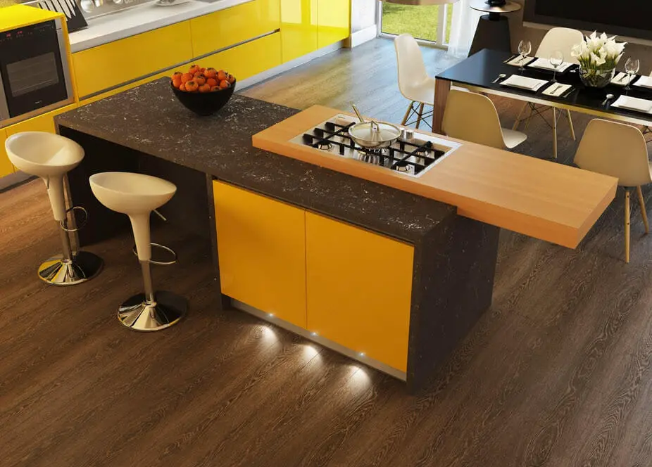 Yellow and black kitchen with white stools
