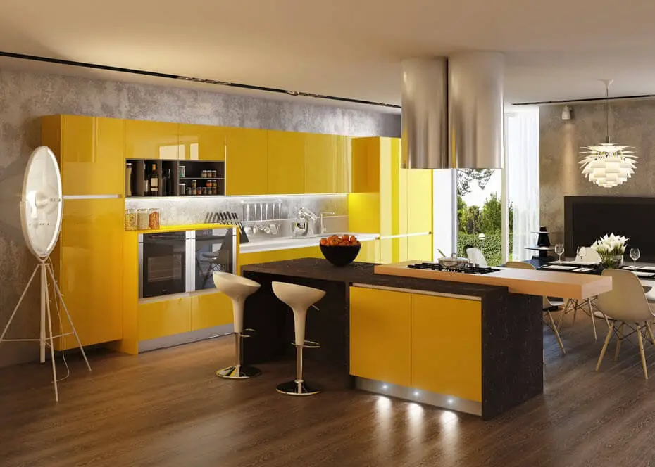 Yellow and black kitchen with wood floors